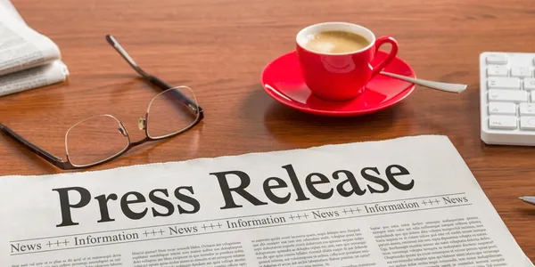Press release newspaper with red coffee cup